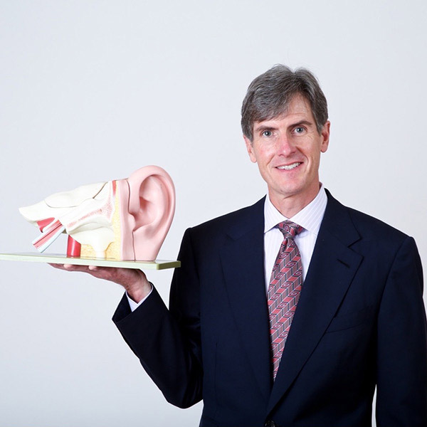 doctor holding ear