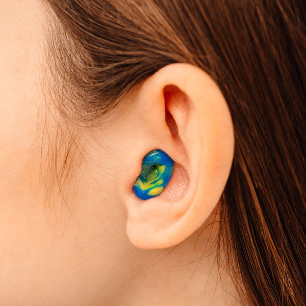 Patient Wearing a Custom Hearing Protection in Castle Rock, CO