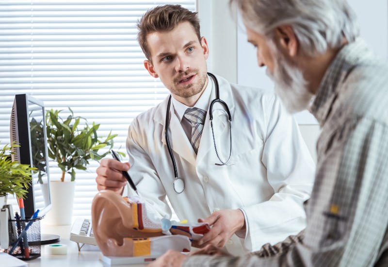 Doctor at Castle Rock Ear Associates Consulting a Deaf Patient in Castle Rock, CO