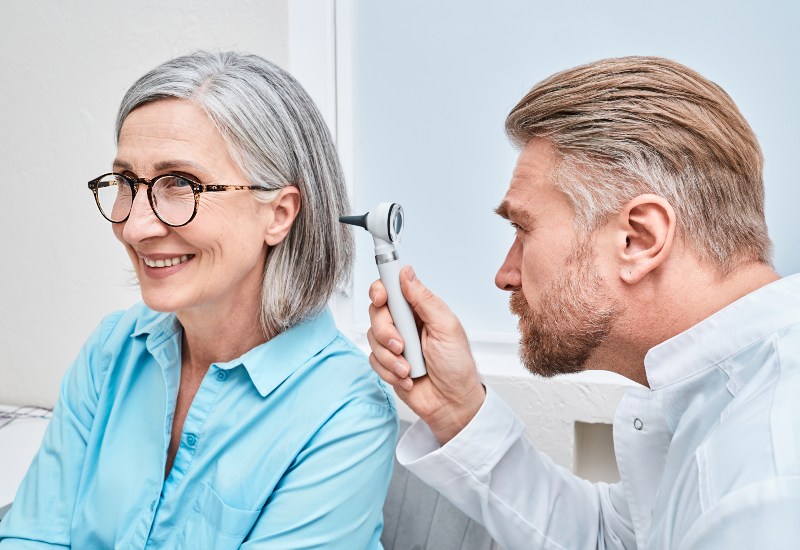 Otolaryngologist Doctor Checking a Women's Ear in Castle Rock, CO
