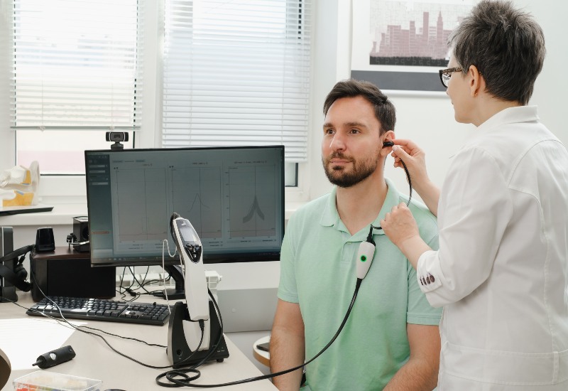 Doctor Audiologist Consulting at Hearing Aid Center in Castle Rock, CO