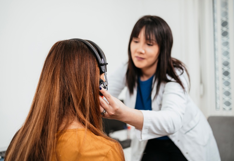 Audiologist Conducting a Hearing Aid Checkup in Castle Rock, CO