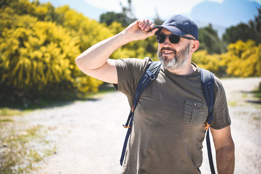 Backpacker Enjoying Outdoors While Protecting Their Hearing During Summer Adventures