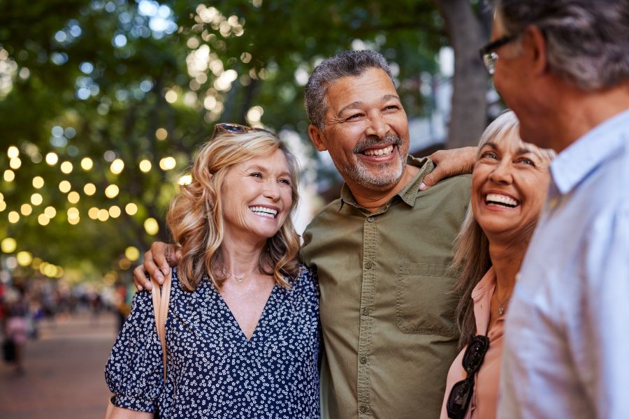 Group of Adults Connecting and Enjoying a Community Gathering With Hearing Loss