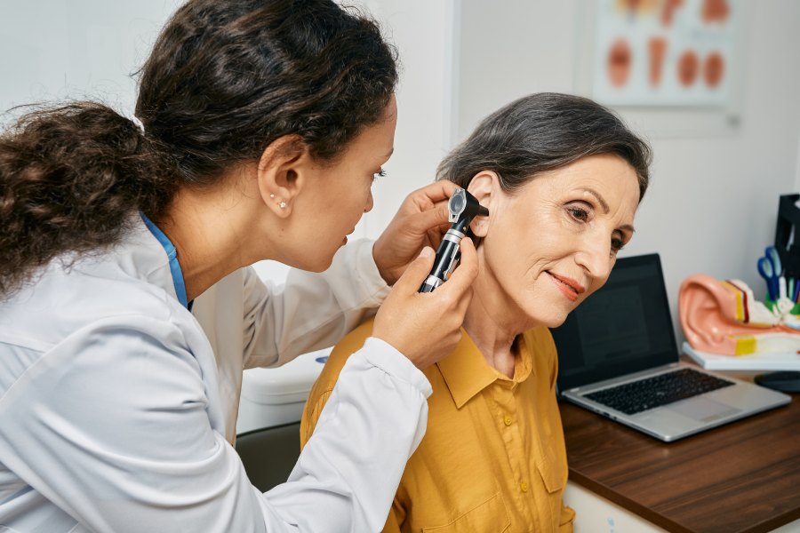 Audiologist Conducting Hearing Assessment and Explaining What Audiologists Actually Do